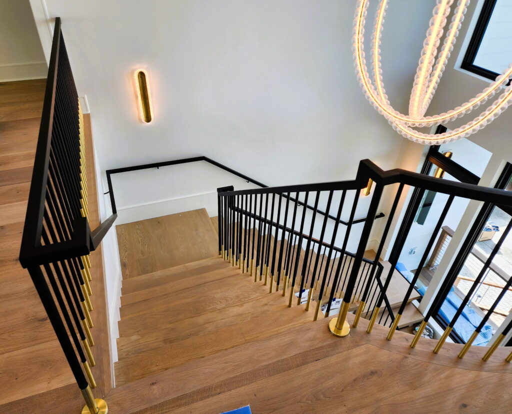 Staircase Remodeling in Arizona Everything Homeowners Need to Know closed riser staircase white oak with custom tread and custom-welded rail system in black metal with brass trim